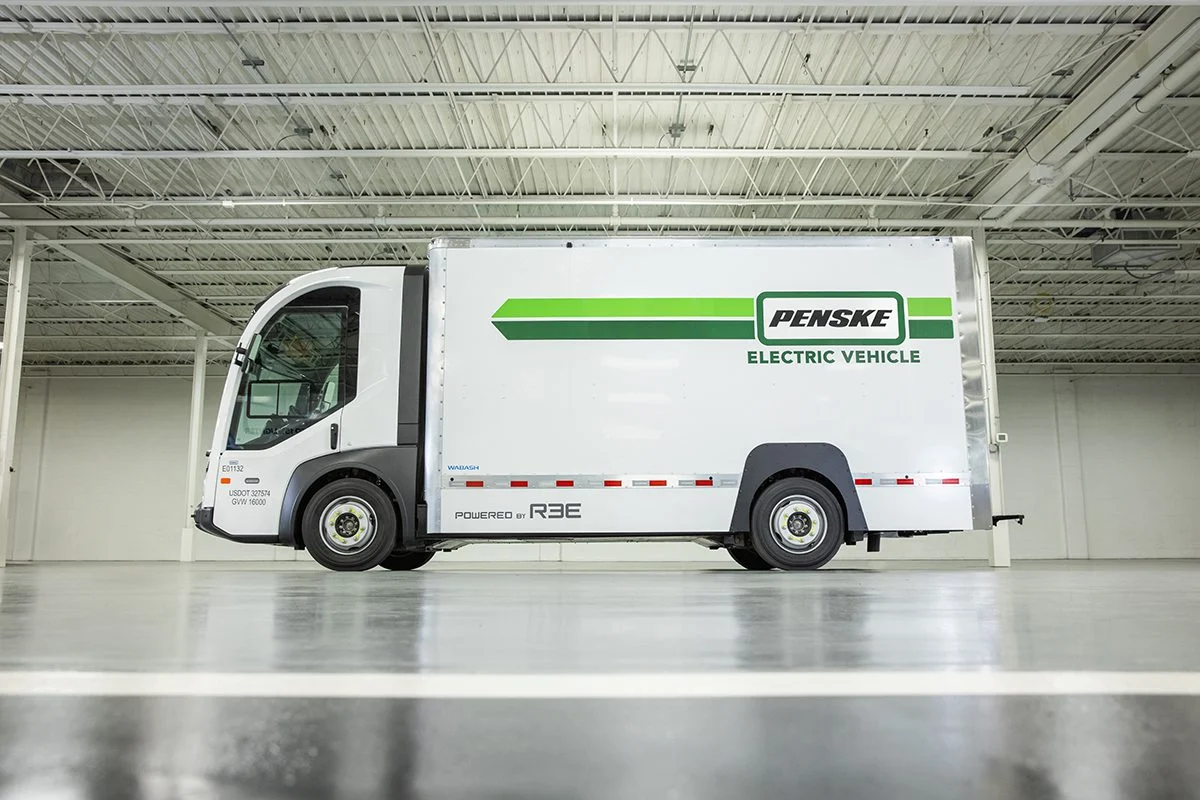 Still image of a REE Automotive, P7-C electric truck with the Penske logo.