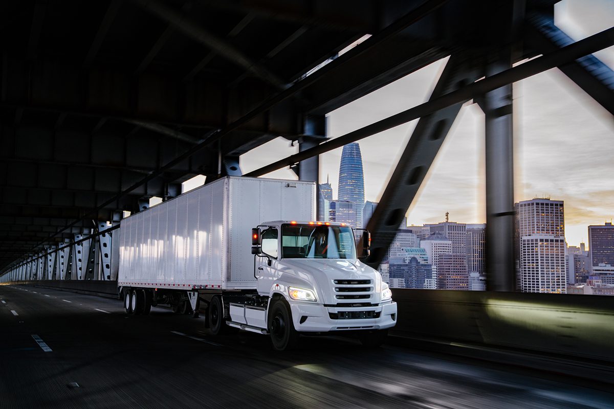 Hexagon Purus and Hino Truck's new zero-emission truck brand, Tem, driving down a highway.